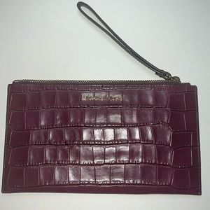 Michael Kors plum clutch